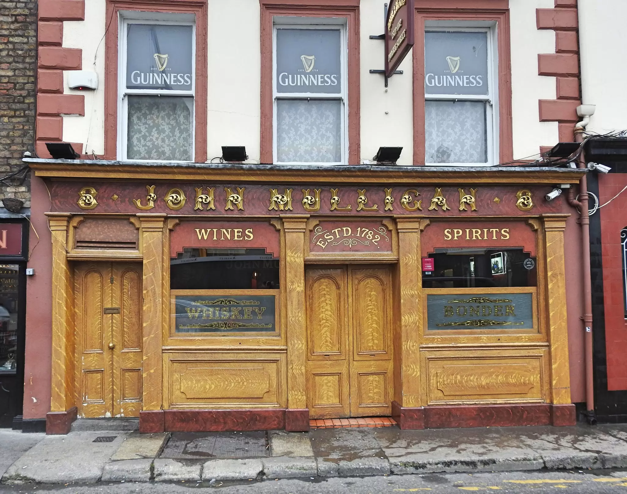 Wooden exterior of Mulligan's Pub on Poolbeg Street. 