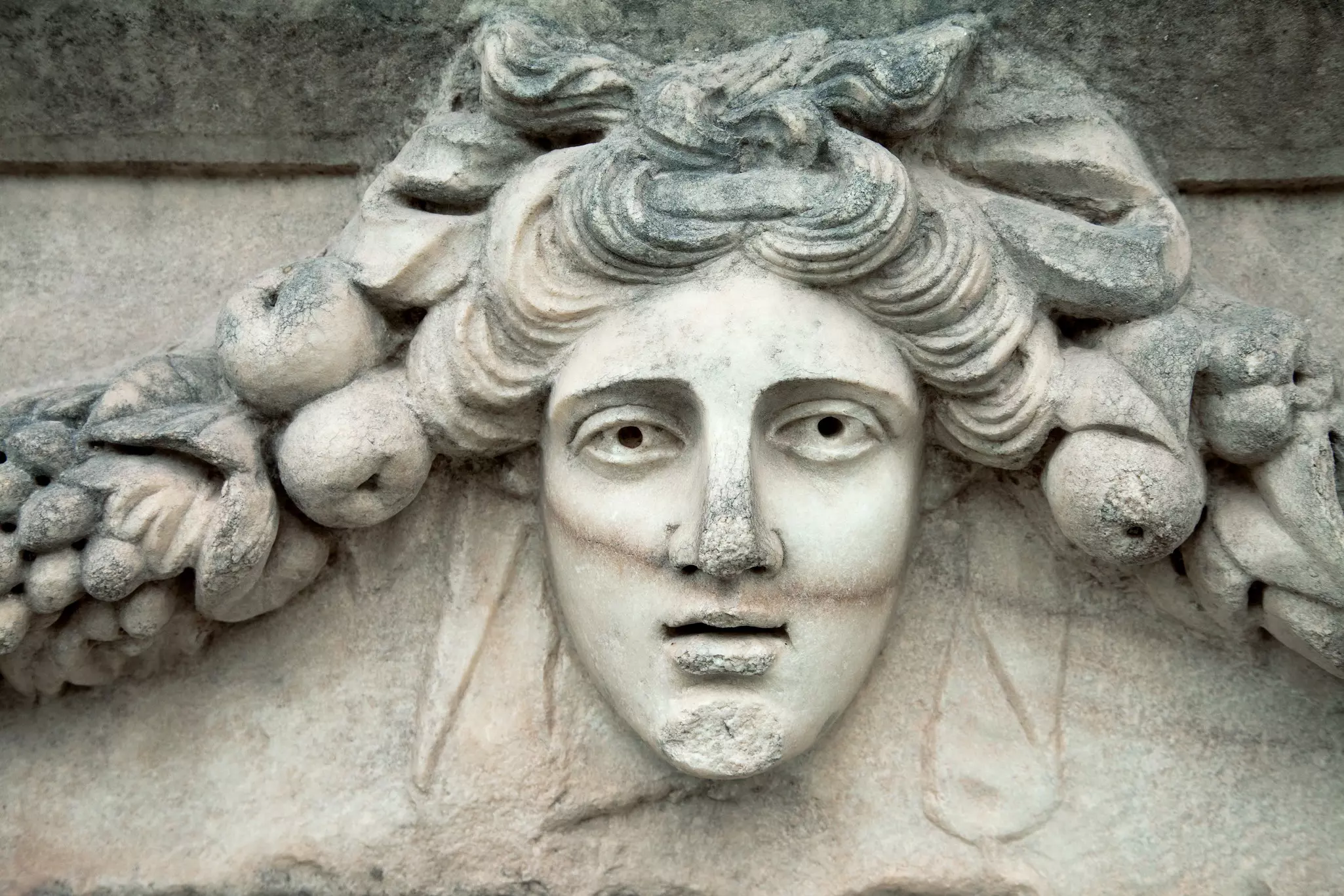 Portrait sculpture detail on a Greek ruin in Aphrodisias