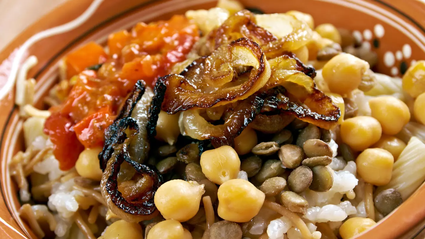 Kushari, an Egyptian dish of rice, macaroni and lentils mixed together, topped with a tomato-vinegar sauce; some add short pieces of spaghetti garnished with chickpeas and crispy fried onions