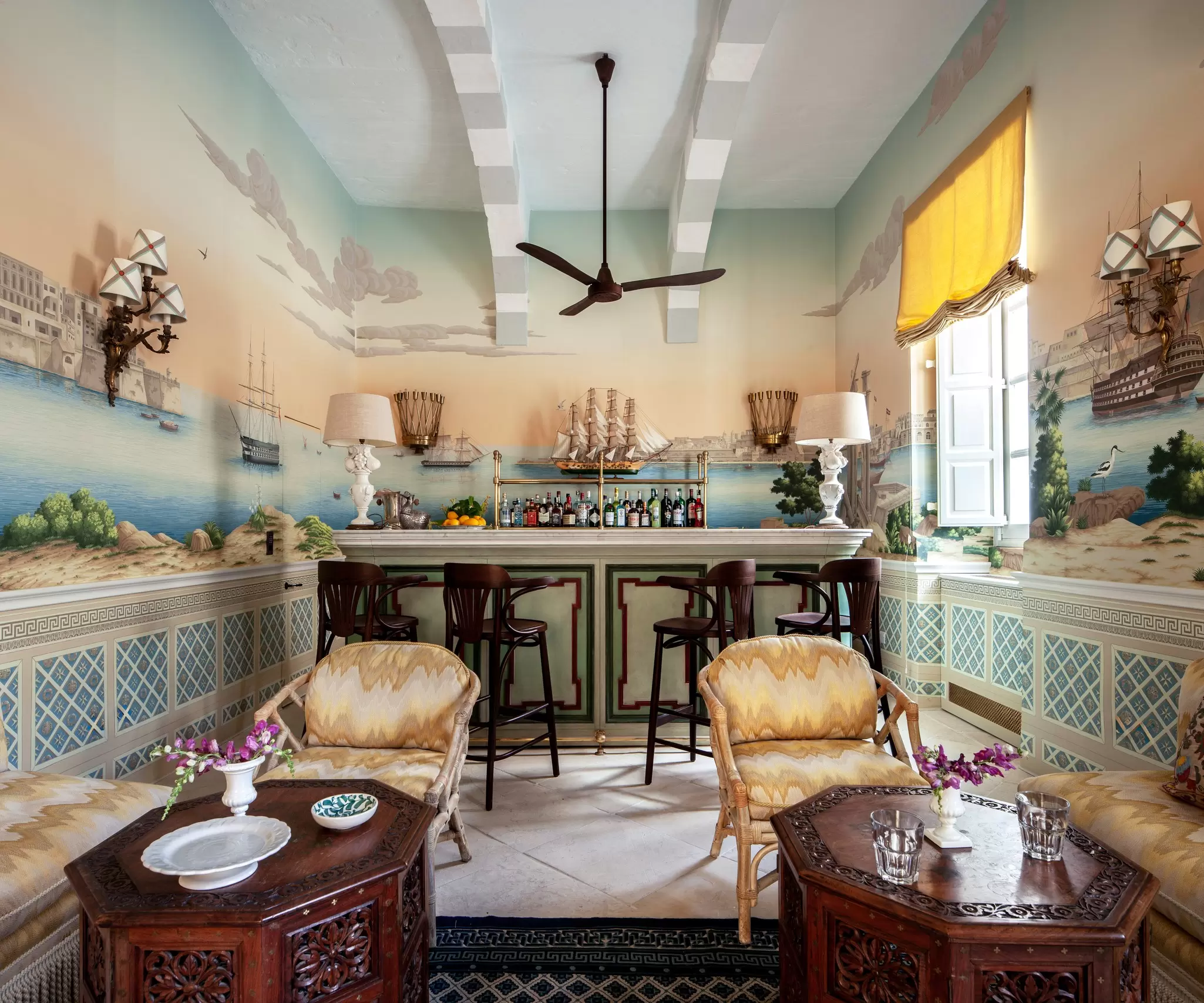 A beautfully decorated bar with naval wallpaper in a hotel: Casa Bonavita in Malta