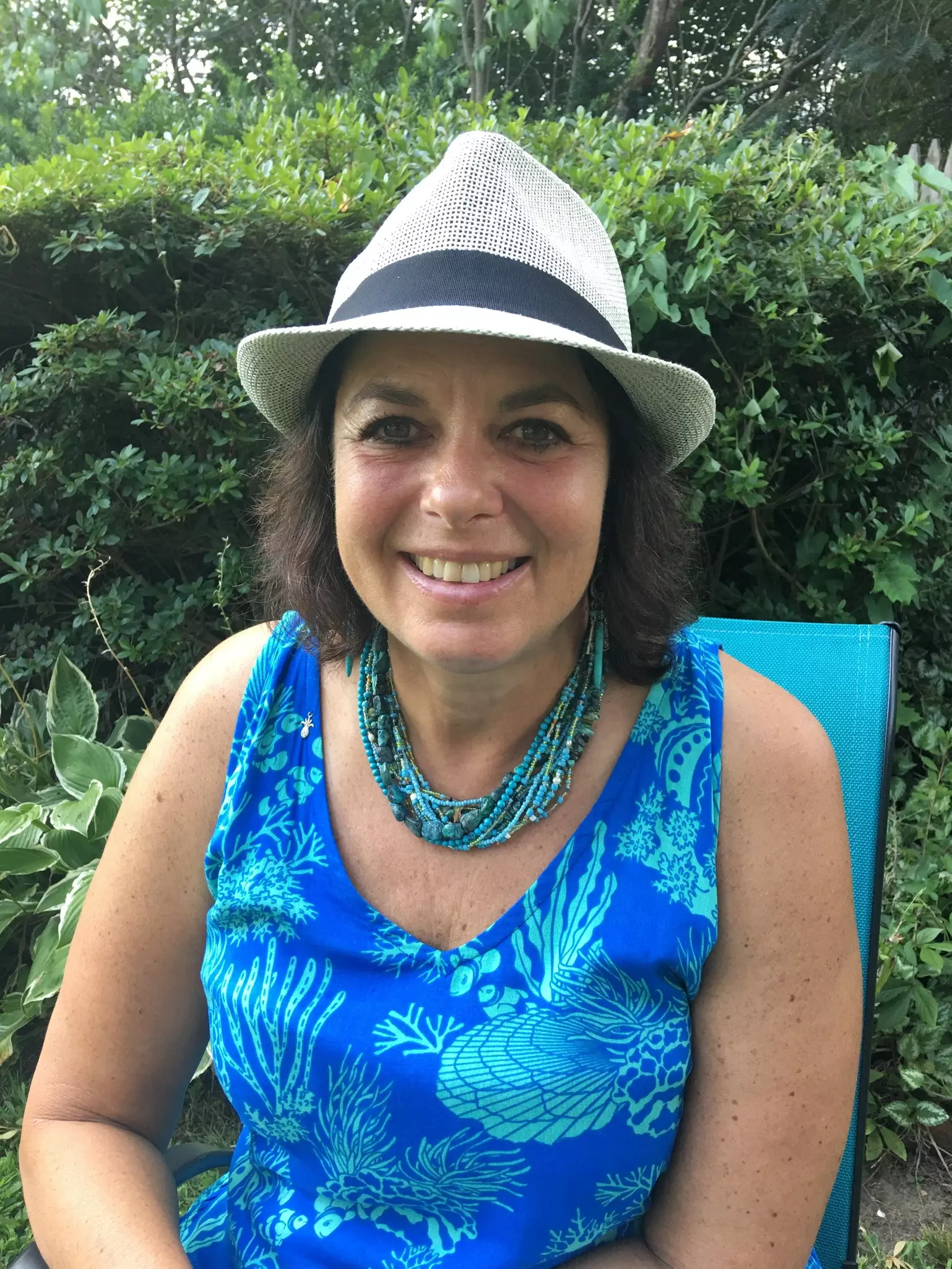 The author holds up a piece of sea ice that could potentially be thousands of years old © Caryn B Davis / Lonely Planet