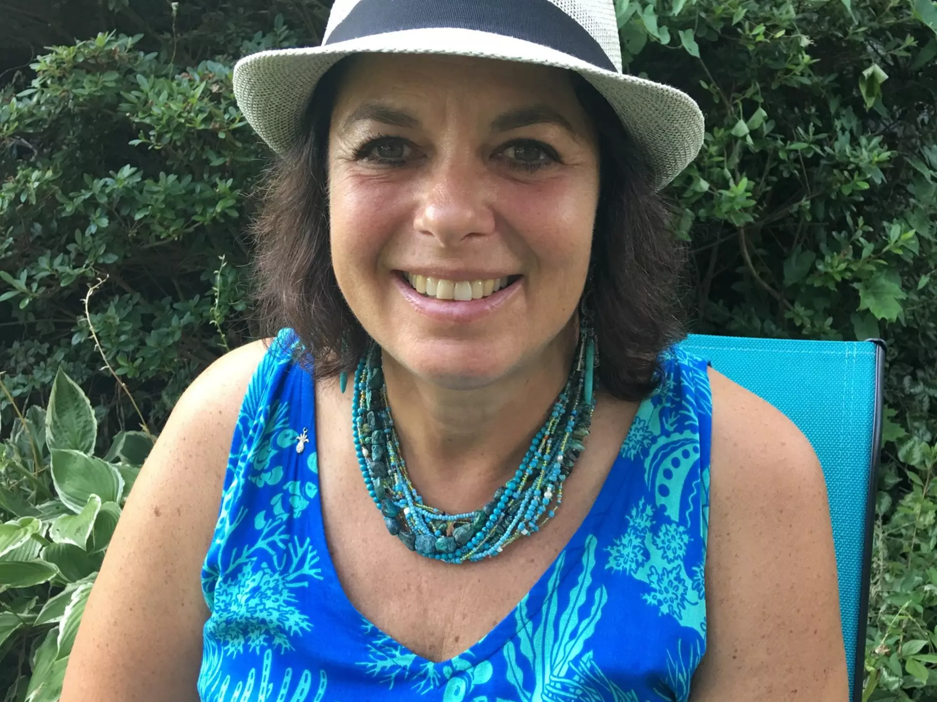 The author holds up a piece of sea ice that could potentially be thousands of years old © Caryn B Davis / Lonely Planet