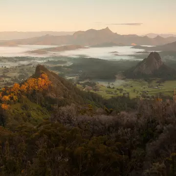 Morning Mist and sunrise - view to Mount Warning, Wollumbin, Mebbin, Border Ranges, Mount Jerusalem National Park, Nightcap, Doon Doon, Uki, Tweed Valley. Byron Bay Hinterland - NSW, Australia  License Type: media  Download Time: 2024-04-11T09:26:22.000Z  User: meg3348277  Is Editorial: No  purchase_order:   