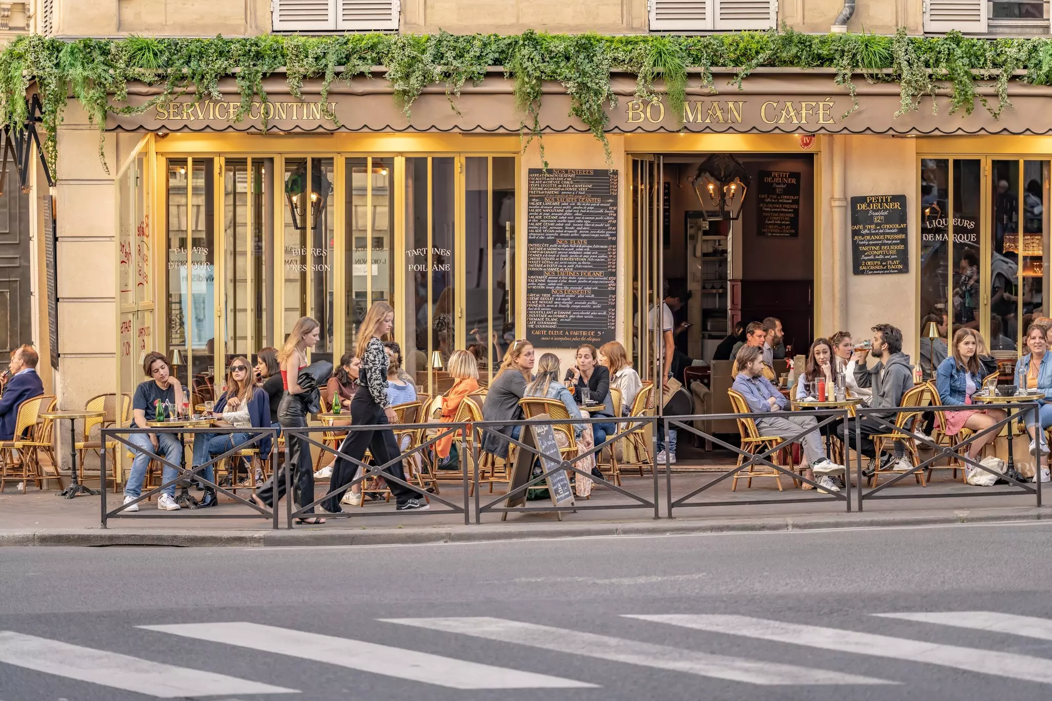 Busy scene at a traditional cafe in the city, in the Pigalle neighborhood.