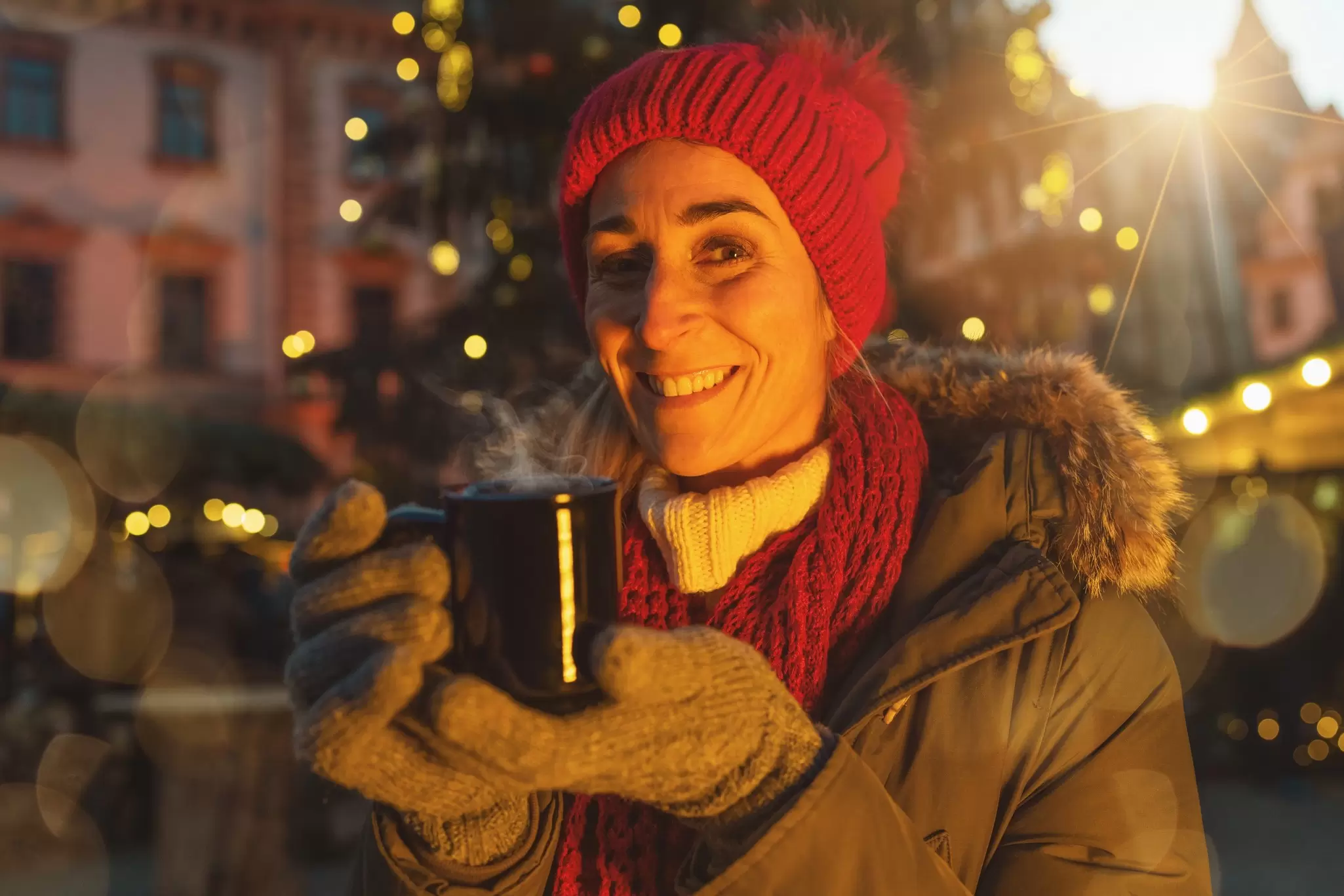Happy woman in front of Christmas tree on Christmas market drinking hot wine at winter, License Type: media, Download Time: 2025-11-14T02:08:08.000Z, User: katherineeloisemarsh73, Editorial: false, purchase_order: 56530 - Guidebooks, job: Global Publishing-WIP, client: Munich Bavaria & the Black Forest 9, other: Kat/Marsh