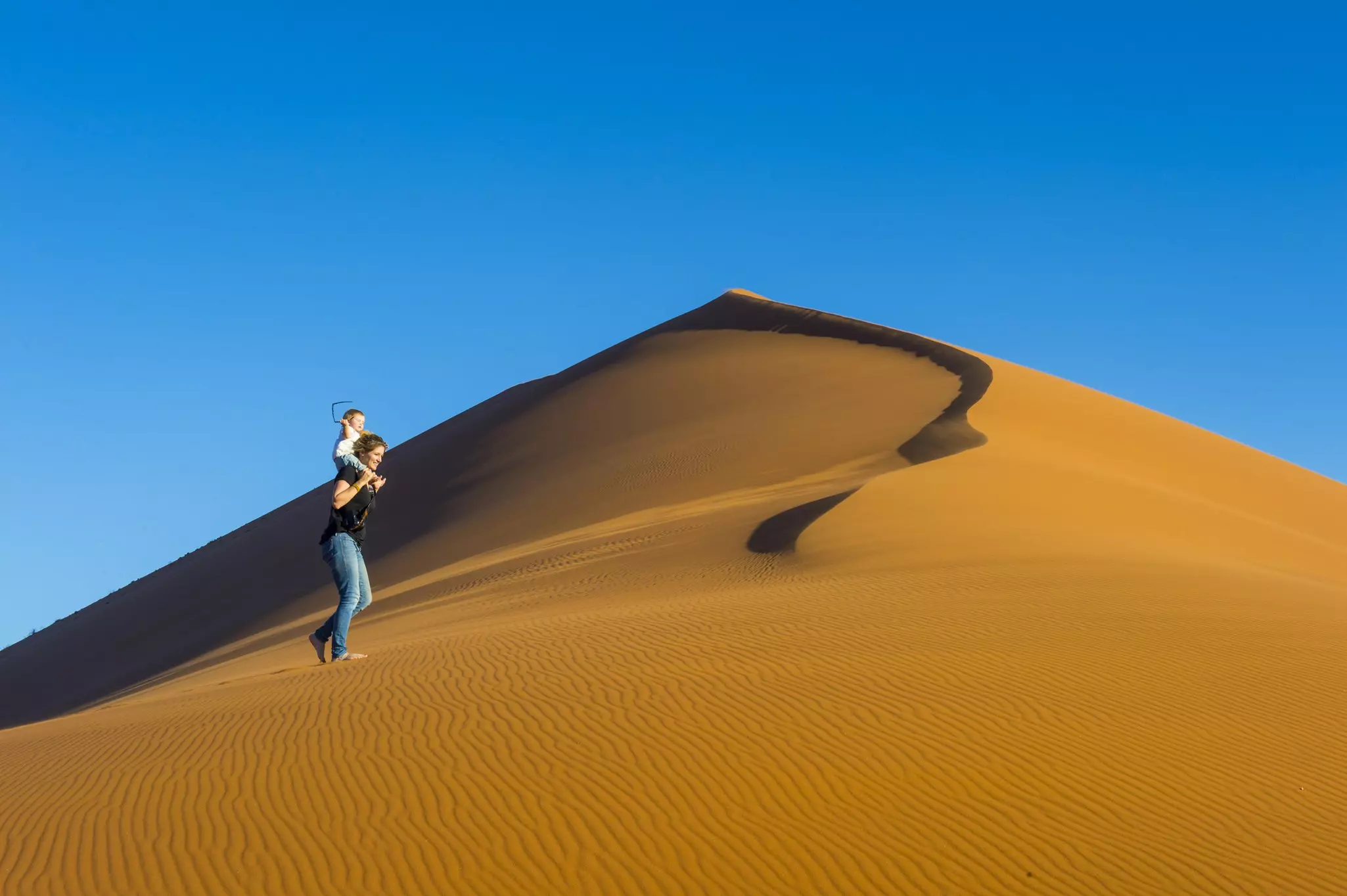 Baby strollers aren't particularly helpful on much of Namibia's terrain! © Michael Runkel / Getty Images