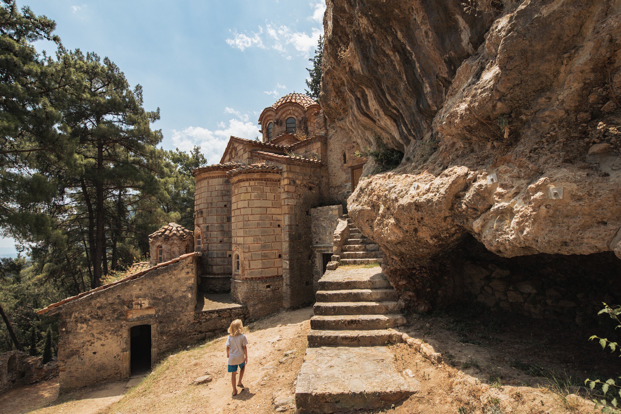 A child explores a church in the town of Mystras in Greece.