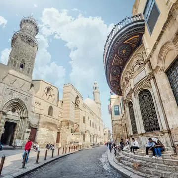 CAIRO, EGYPT, January 24, 2018: The minaret of Qalawun complex rises over Al-Muizz street.; Shutterstock ID 1342943672;