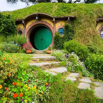 Hobbit holes and hobbit gardens in Hobbiton Movie Set, New Zealand.