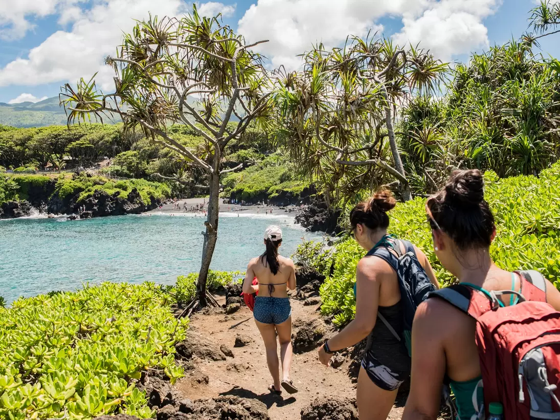 Hikers on hiking trail, Waianapanapa State Park, Maui, Hawaii