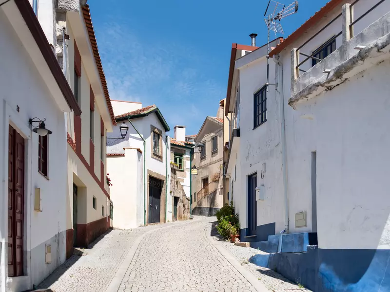 A traditional whitewashed Mediterranean village on a sunny day