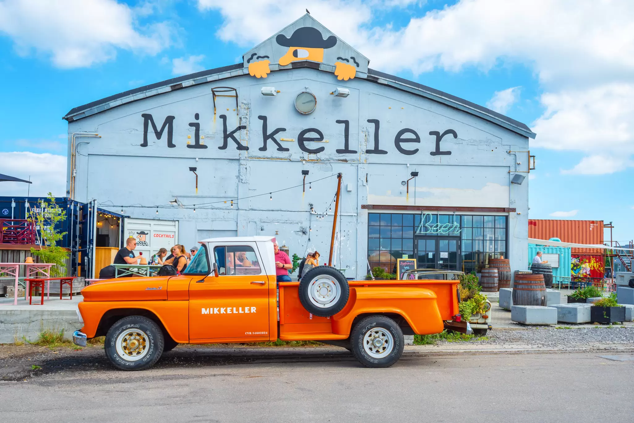 View of an old car in front of the Mikkeller beer bar on Refshaleøen in Copenhagen, Denmark.