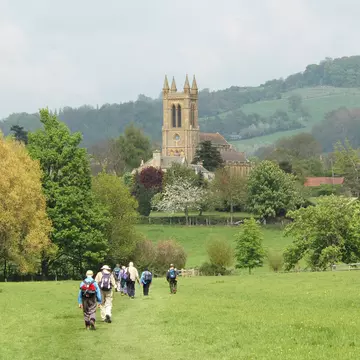 A group of older walkers on the Cotswold Way near Broadway, UK.