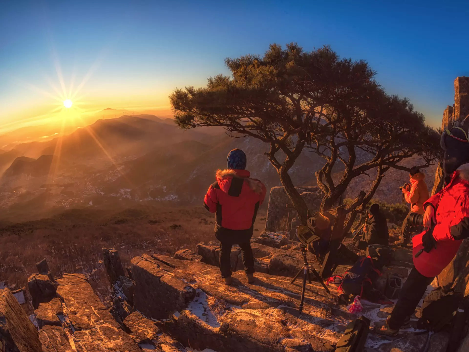 Hiker in Jeollanam-do province at sunrise overlooking the mountains in South Korea