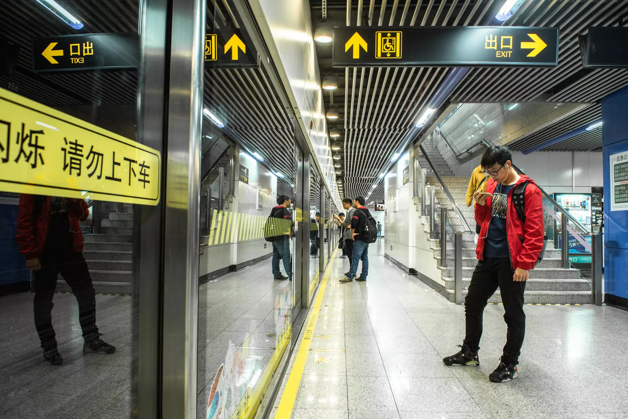 Passengers wait for the metro in Shanghai, China.