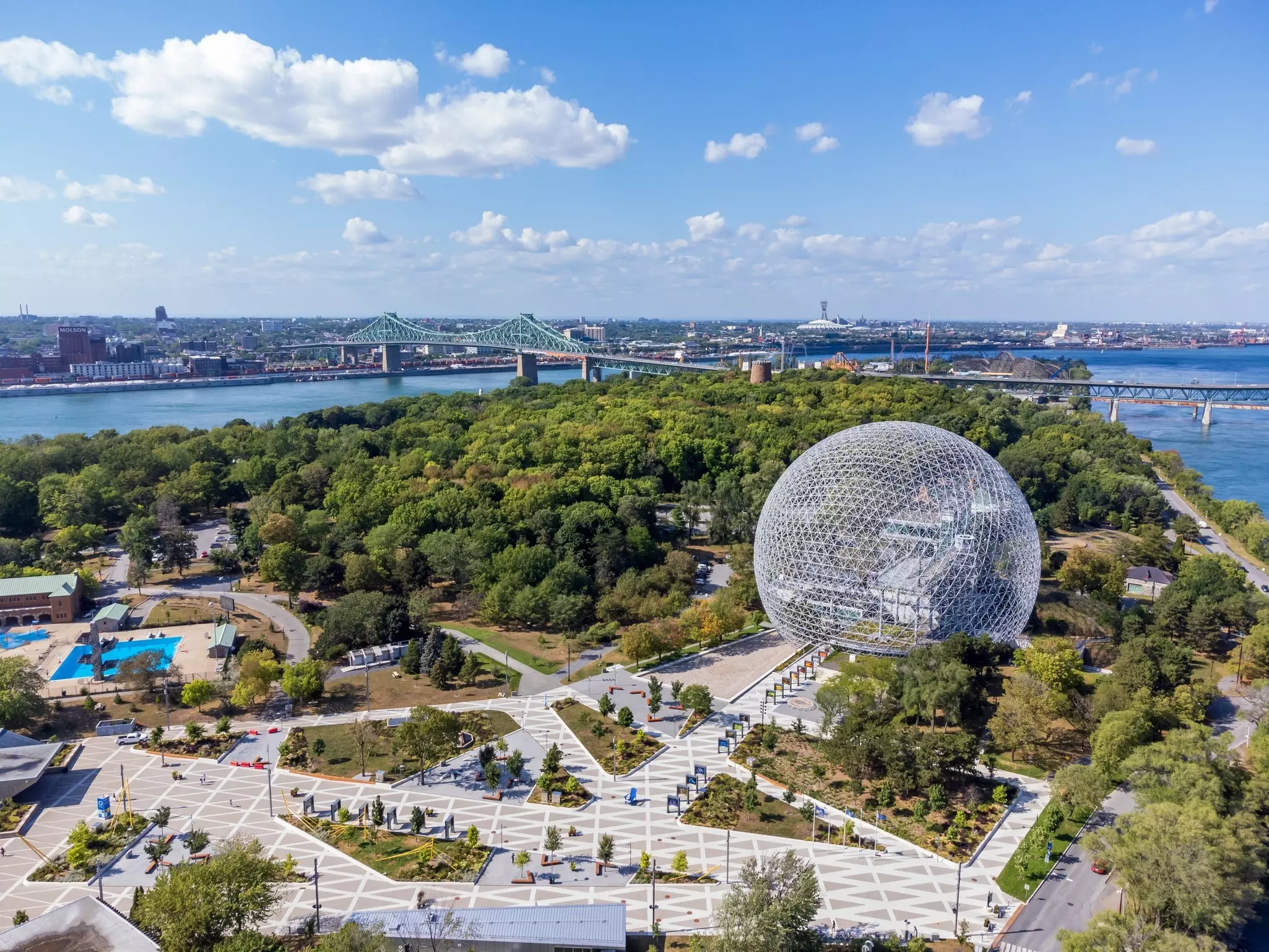 A large park with a central spherical structure