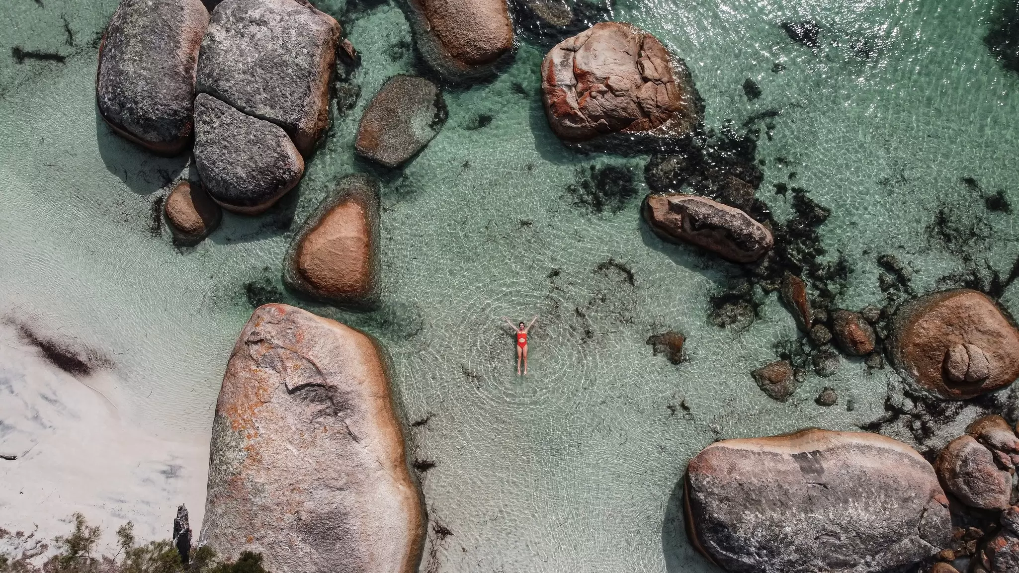 Swimming in the fairy pool in Albany, Western Australia. Elsalass/Shutterstock