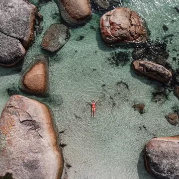 Swimming in the fairy pool in Albany, Western Australia. Elsalass/Shutterstock