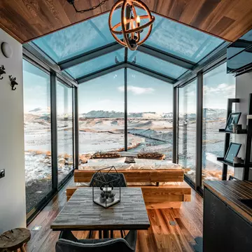 A suite with a window wall at Panorama Glass Lodge, Iceland