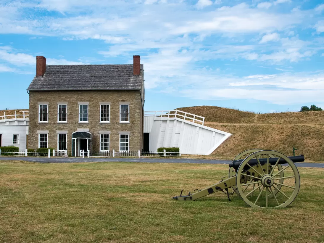 The Headquarters of old revolutionary war Fort Ontario, with a cannon in the foreground in Toronto, Canada.