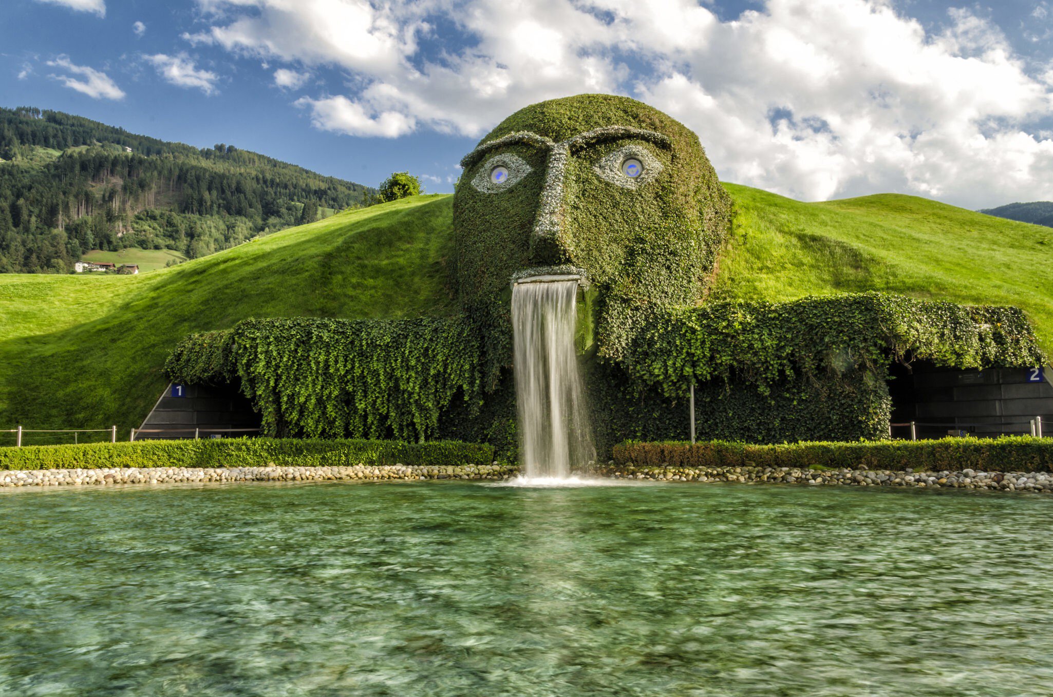 INNSBRUCK, AUSTRIA - AUGUST 16: Swarovski Kristallwelten (Crystal Worlds) crystal-themed theme park entrance on August 16, 2013 near Innsbruck, Austria.
