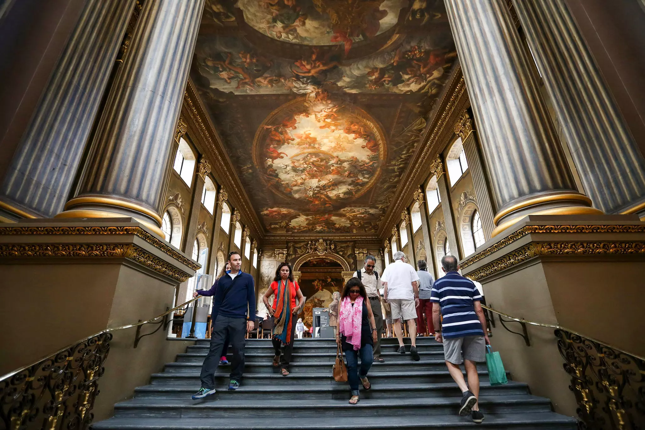 Visitors view the Painted Hall in the Old Royal Naval College on July 22, 2015 in Greenwich, England.
