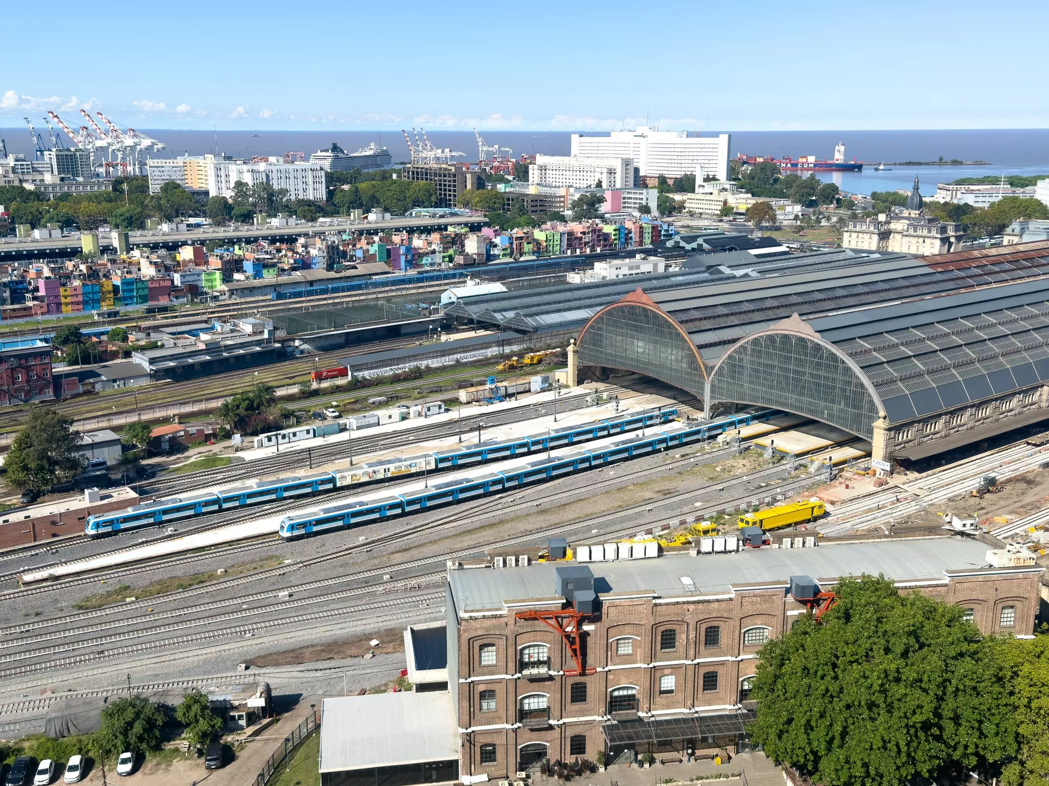 A large station with several rail lines in a port city.