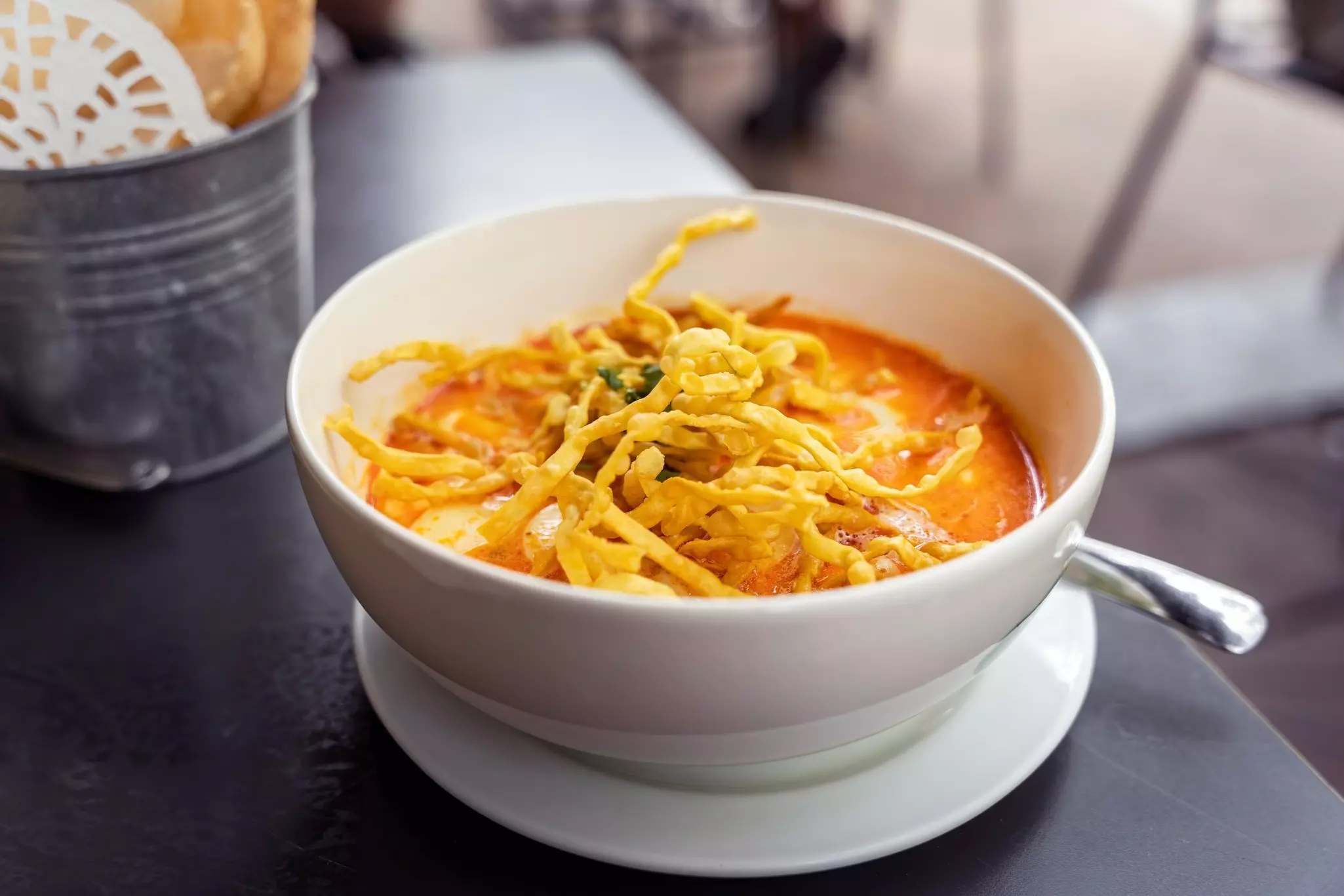 A bowl of khao soi noodle soup in Chiang Mai, Thailand.