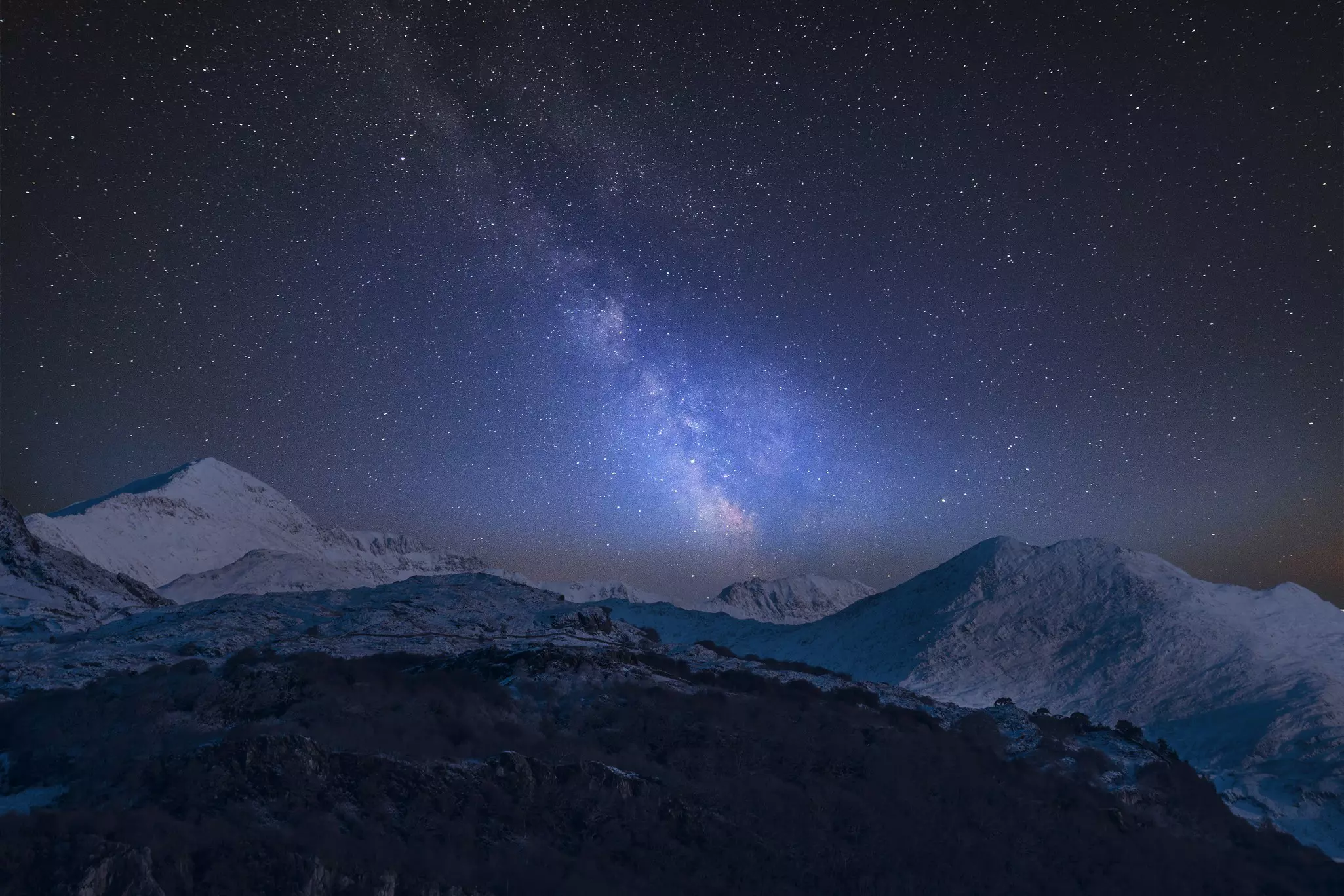 Milky Way over Mount Snowdon and other peaks in Snowdonia National Park.