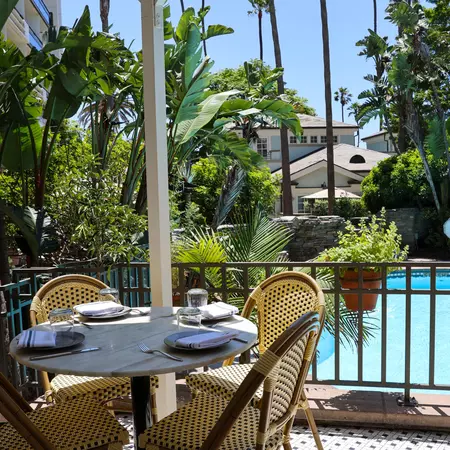 A table next to a pool. 