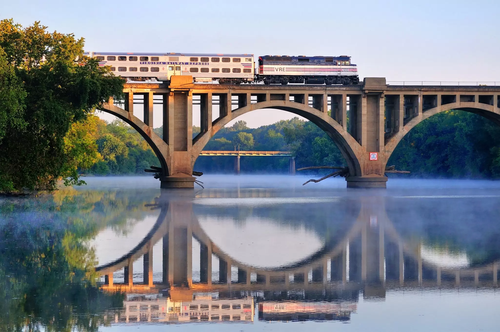 An early morning Virgina Railway Express commuter train passes over the Rappahannock River en route to Washington, D.C., 