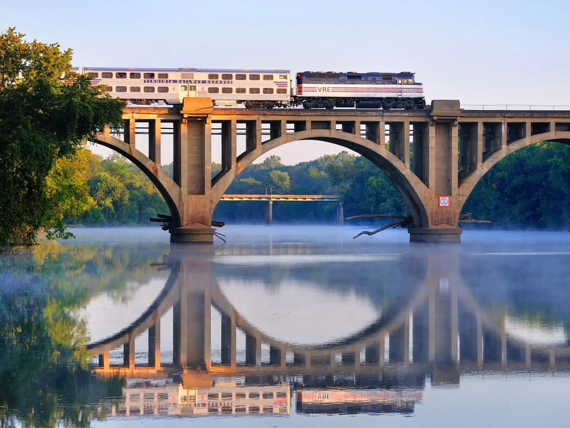 An early morning Virgina Railway Express commuter train passes over the Rappahannock River en route to Washington, D.C., 