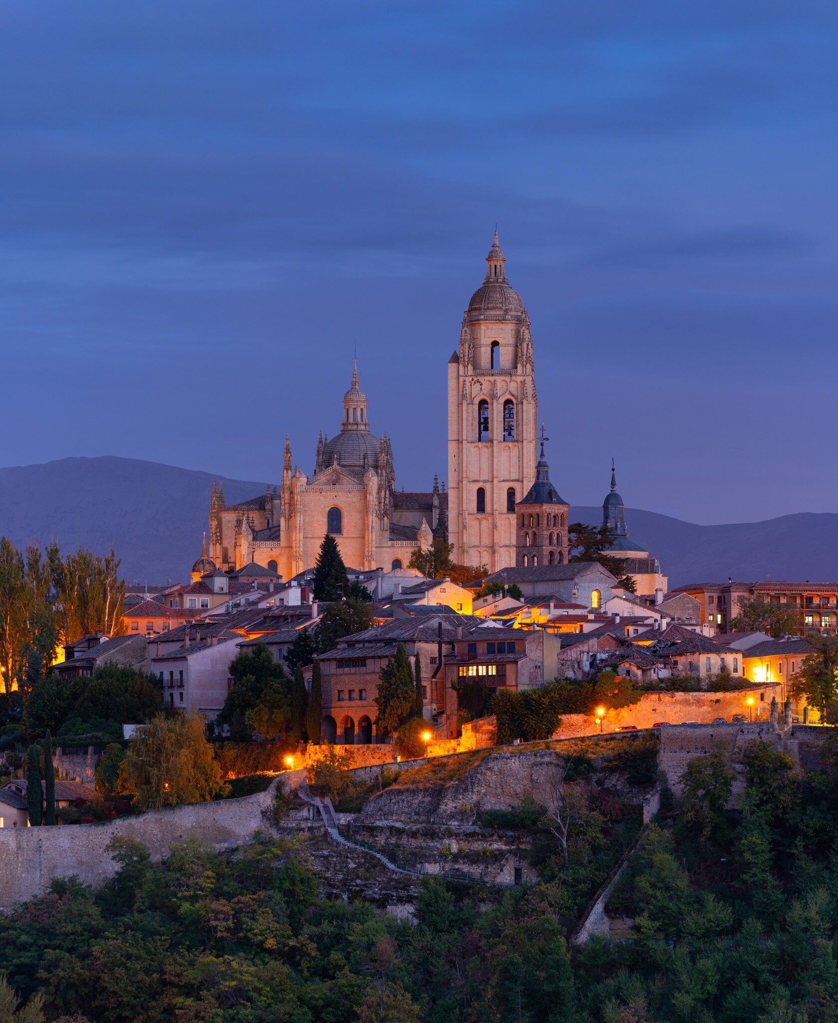 Aerial view of the Cathedral and city of Segovia during the evening in Spain.