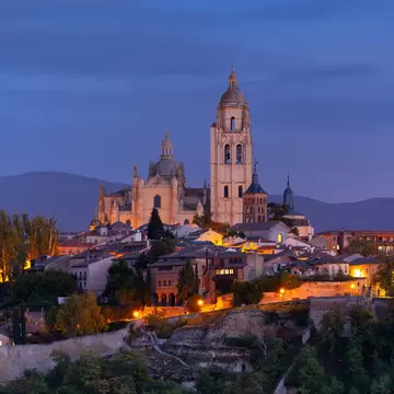 Aerial view of the Cathedral and city of Segovia during the evening in Spain.