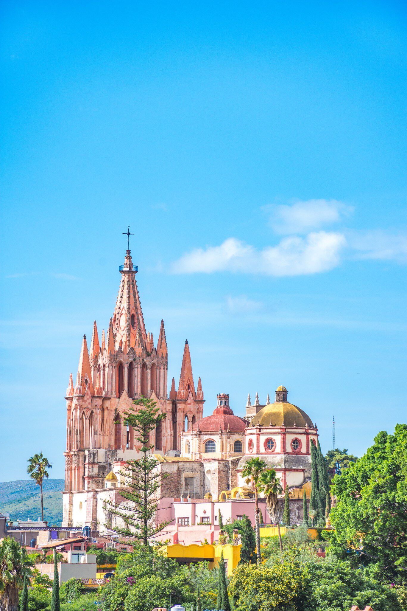 View of the Parroquia de San Miguel Arcángel on a sunny day in San Miguel de Allende, Mexico.