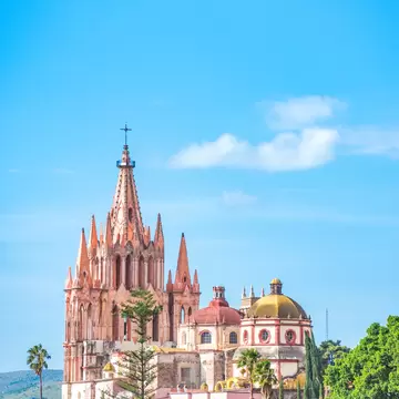View of the Parroquia de San Miguel Arcángel on a sunny day in San Miguel de Allende, Mexico.