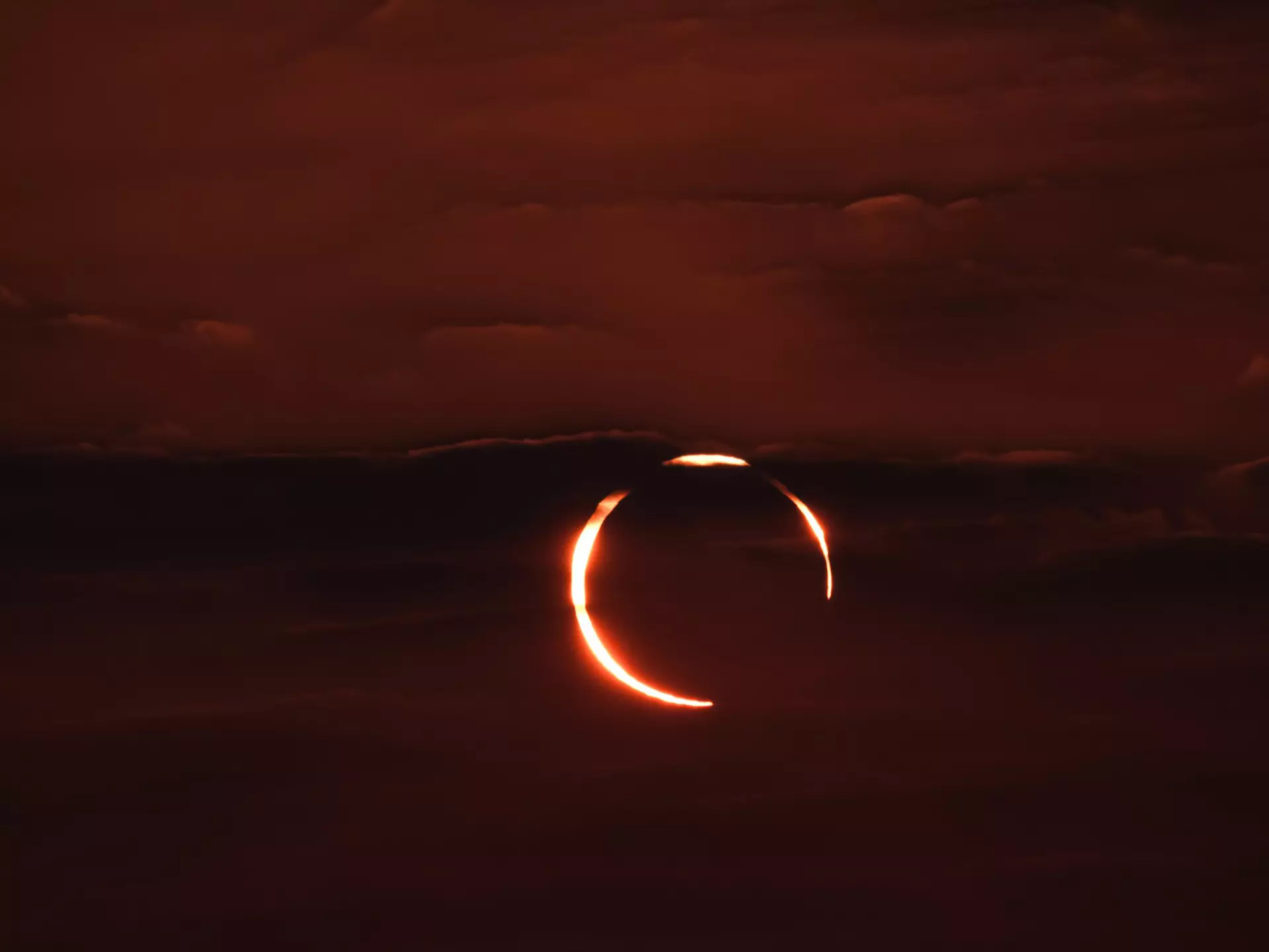 December 26, 2019. The rare Annular "ring of fire" solar eclipse as seen from the Corniche road in Doha, Qatar. Annular eclipses occur when the Moon is not close enough to the Earth to completely obscure the Sun, leaving a thin ring of the solar disc visible.
1196374941
