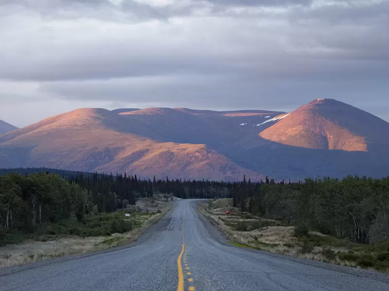 Remote road and mountains at dusk