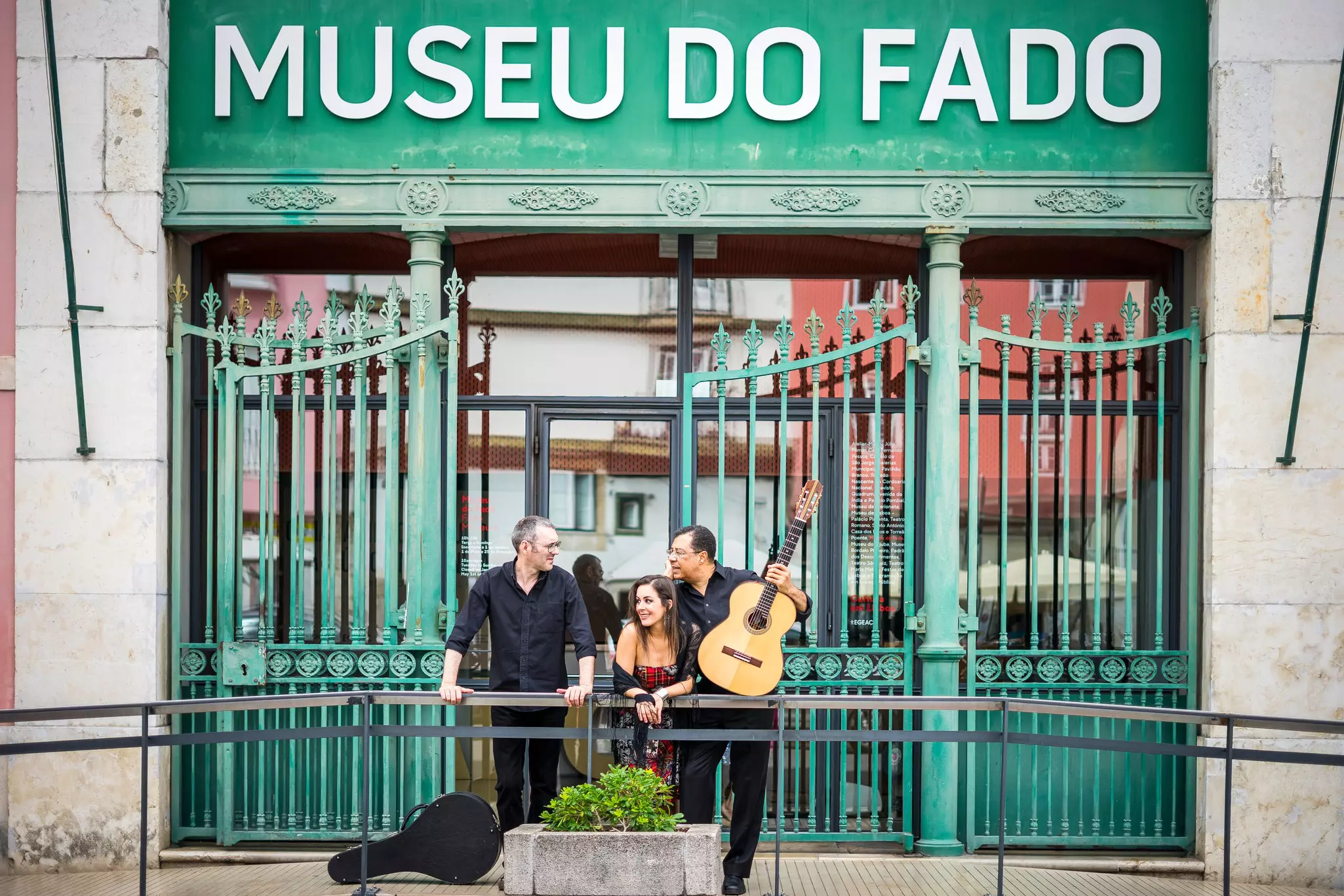 Portuguese guitar player, fado singer and acoustic guitar player in front of Fado Museum in Lisbon, Portugal  License Type: media  Download Time: 2021-11-22T08:12:46.000Z  User:   Is Editorial: No  purchase_order:   