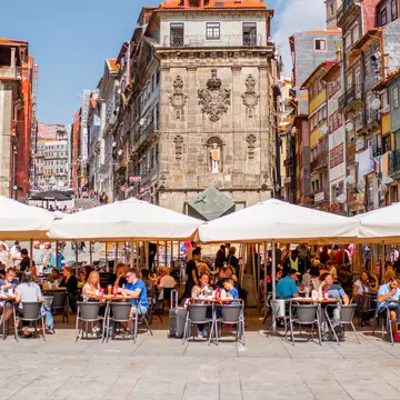 PORTO, PORTUGAL - September 25, 2017: View on the Ribeira square with tourists sitting at the bars and restaurants in Porto city, Portugal
875781924
Photography, Tourism, Portugal, Tradition, Beautiful Woman, Europe, Cityscape, Architecture, Square - Composition, European Culture, Horizontal, History, People, Facade, Town Square, Old, Street, Ukraine, Town, Outdoors, Commercial Kitchen, Building Terrace, Bar - Drink Establishment, City Life, Cafe, Built Structure, Food and Drink Establishment, Portuguese Culture, Lifestyles, Environment, Porto - Portugal, Restaurant, Ancient