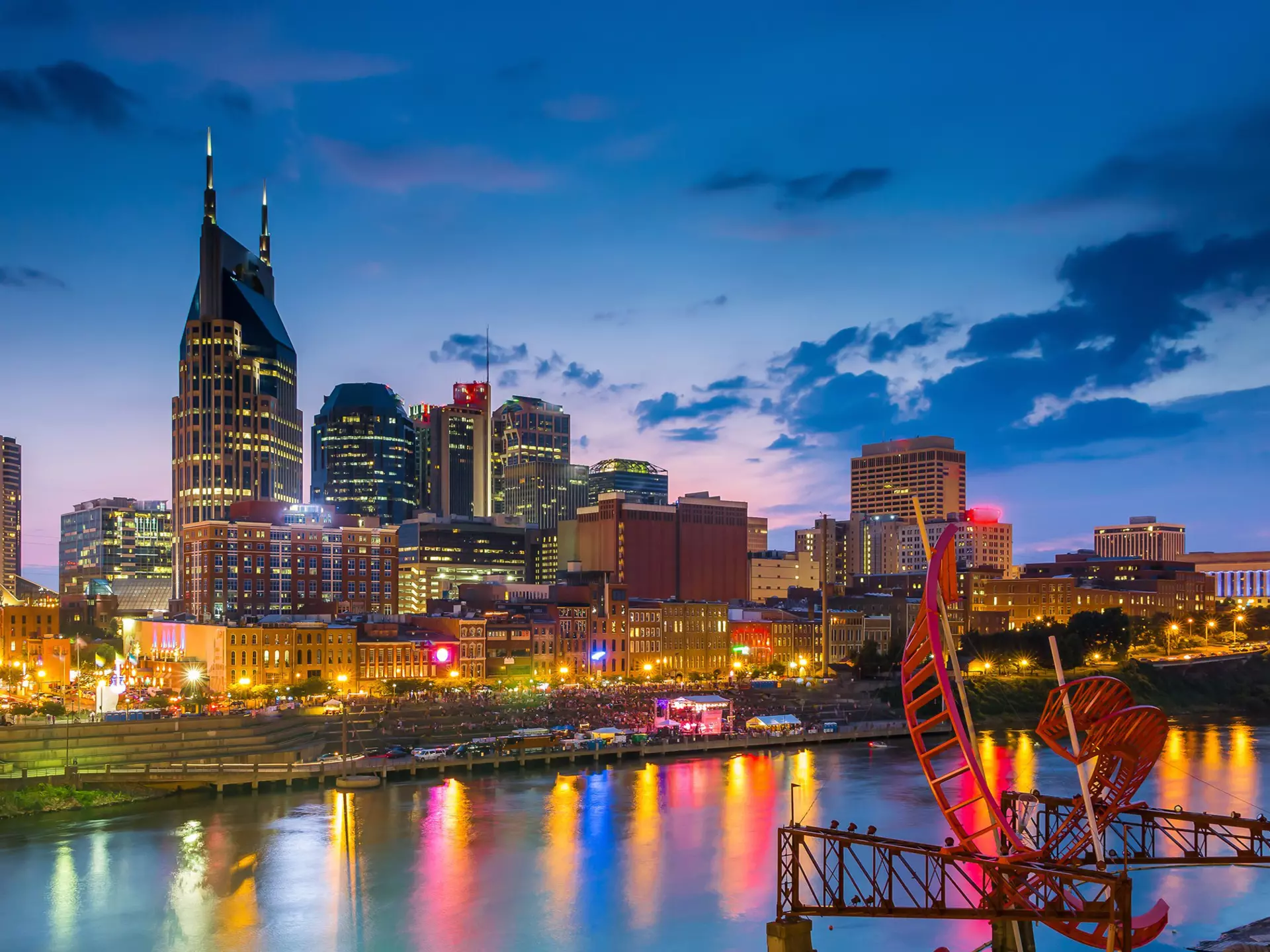 Nashville, Tennessee downtown skyline at twilight.
america, american, architecture, attraction, bridge, broadway, buildings, city, cityscape, cumberland, destination, downtown, dusk, famous, landmark, lights, location, lower, music, nashville, night, office, pedestrian, place, river, scene, scenery, shelby, skyline, southern, states, street, sunset, tennessee, tn, tourist, town, travel, twilight, united, urban, us, usa, view, water