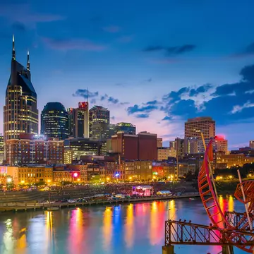 Nashville, Tennessee downtown skyline at twilight.
america, american, architecture, attraction, bridge, broadway, buildings, city, cityscape, cumberland, destination, downtown, dusk, famous, landmark, lights, location, lower, music, nashville, night, office, pedestrian, place, river, scene, scenery, shelby, skyline, southern, states, street, sunset, tennessee, tn, tourist, town, travel, twilight, united, urban, us, usa, view, water