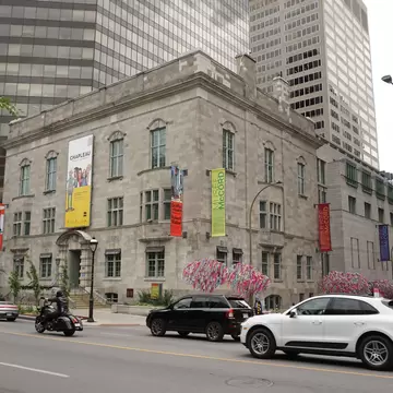 Montreal, QC/Canada - 6/26/2020: a combination of old and modern architecture at the same scene, the historical building of McCord museum with a background of a modern building of McGill University.