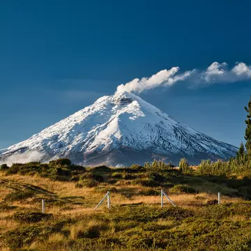 Cotopaxi volcano with a distinct plume of smoke in the national park, License Type: media, Download Time: 2026-01-16T20:22:25.000Z, User: katelyn.perry_lonelyplanet, Editorial: false, purchase_order: 65050 - Digital Destinations and Articles, job: wip, client: wip, other: Katelyn Perry