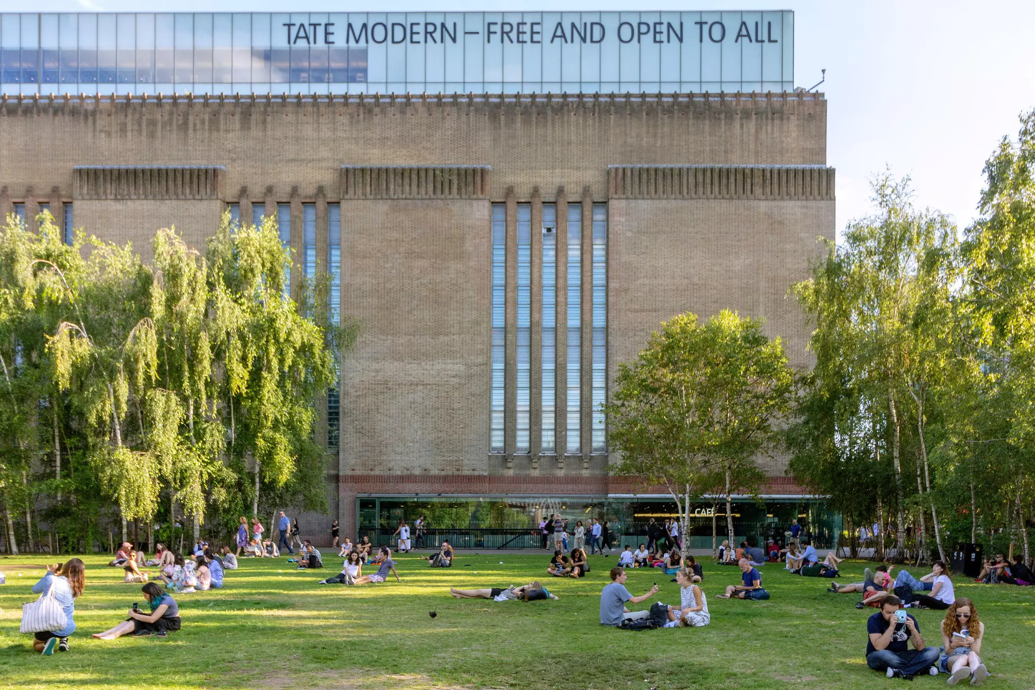 AUGUST 2, 2018: People seated on the grass outside the Tate Modern art gallery.
1161326563
architecture, art, art gallery, attraction, bankside, brick, british, building, capital, chimney, city, cityscape, construction, contemporary, culture, destination, downtown, england, english, europe, exhibition, exterior, famous, gallery, great britain, heritage, historical, history, international, landmark, london, modern, modern art, monument, museum, people, power, station, structure, tate, tate modern, tourism, tourist, touristic, tower, travel, uk, united kingdom, urban, view