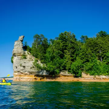 Kayakers in Pictured Rocks National Lakeshore, Michigan. KYPhua/Shutterstock