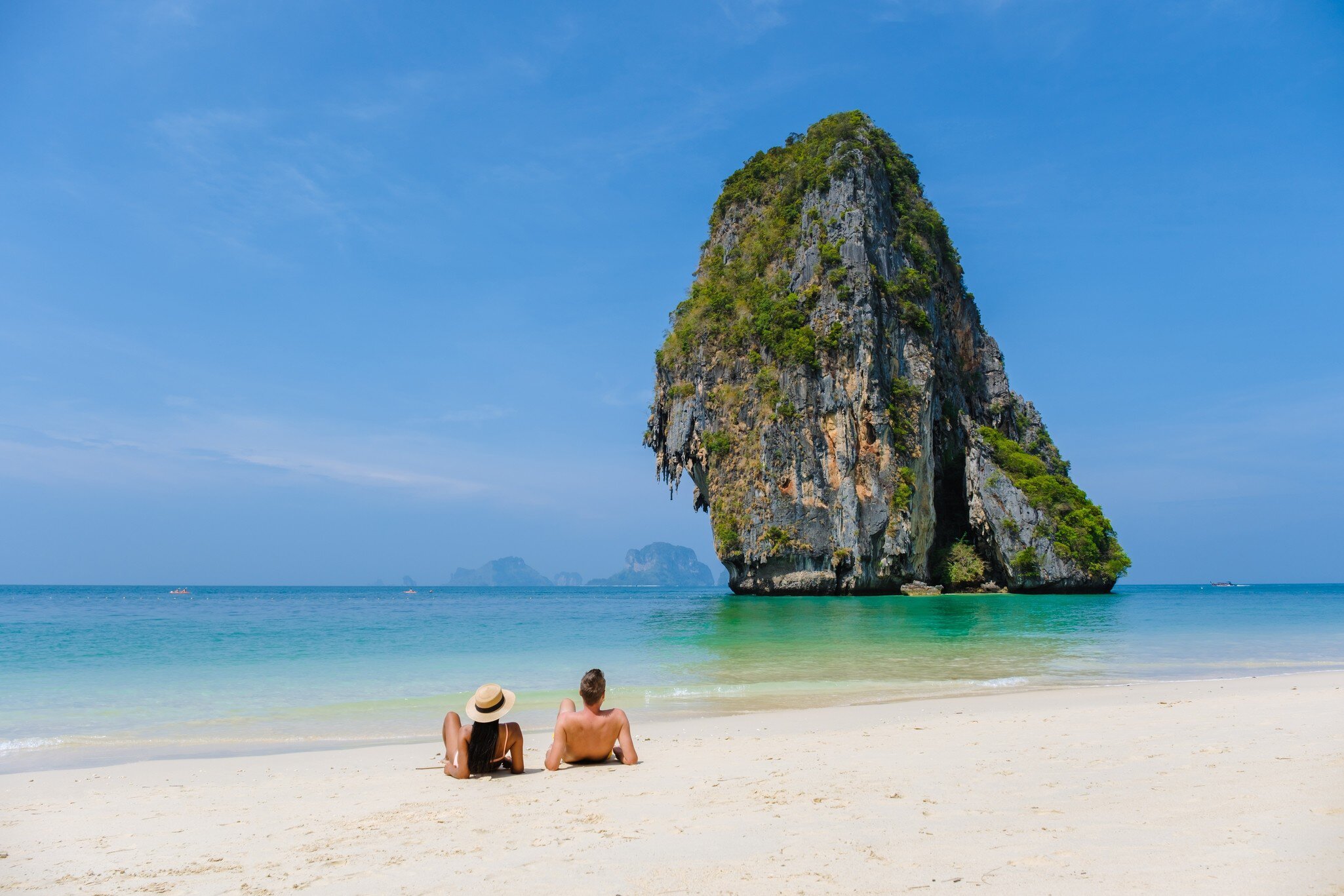 Railay Beach Krabi Thailand, the tropical beach of Railay Krabi. couple of men and women on the beach during vacation in Krabi, Thailand.