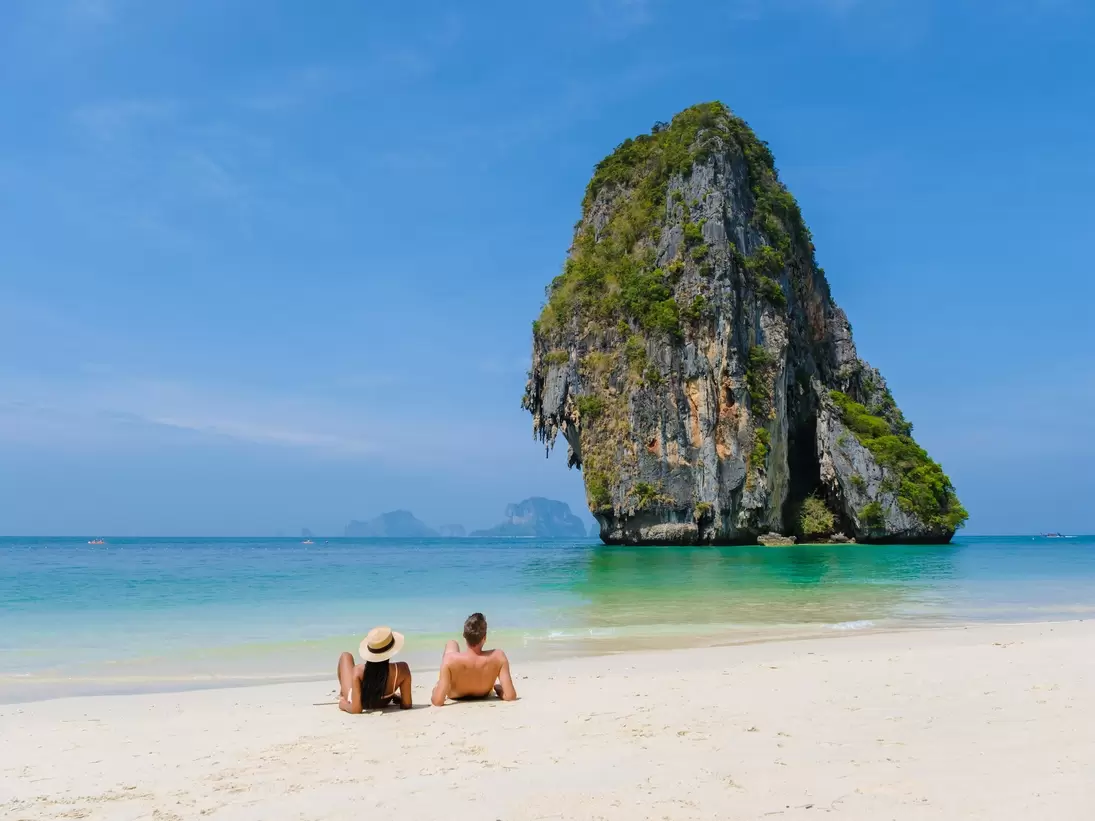 Railay Beach Krabi Thailand, the tropical beach of Railay Krabi. couple of men and women on the beach during vacation in Krabi, Thailand.