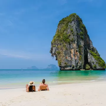 Railay Beach Krabi Thailand, the tropical beach of Railay Krabi. couple of men and women on the beach during vacation in Krabi, Thailand.