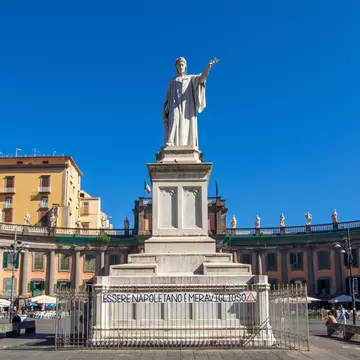 The statue of Dante Alighieri – work of sculptors Tito Angelini and Tommaso Solari Junior – in the Piazza Dante in Naples, Italy.